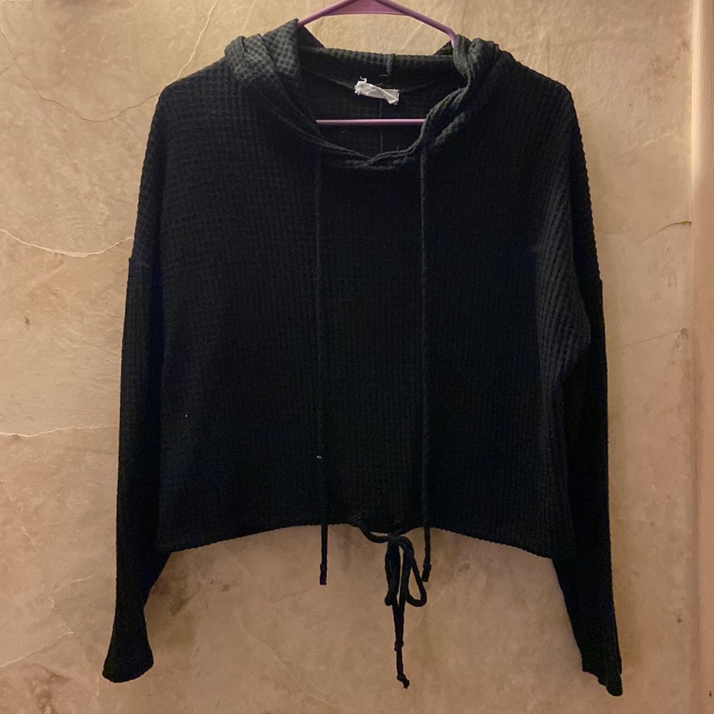 Black hoodie. Ties in front at bottom to make it tighter around your waist!